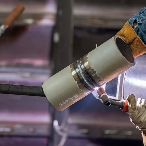 View of the welding procedure qualification and welder test for pipe (HL-045 or 6G position). Welders performing the 6G certification test must weld in all positions including horizontal and vertical.